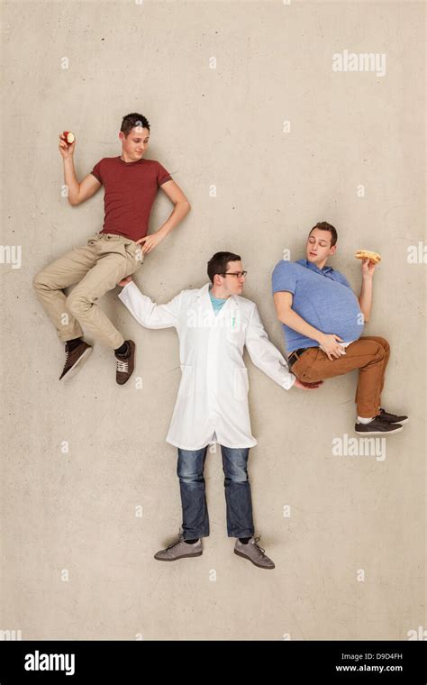 Man holding men in hands Stock Photo - Alamy