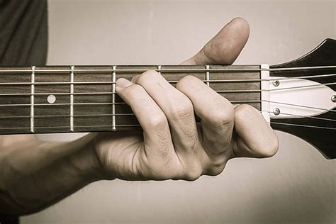 Acoustic Guitarists Hand Forms C Major Chord In Front View Photo Background And Picture For Free