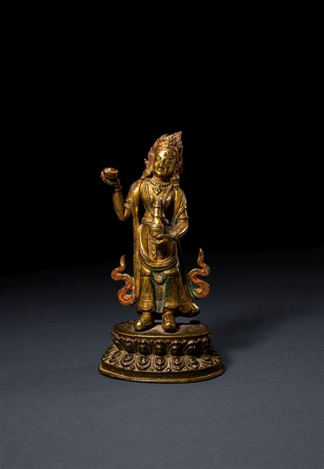 Lot A GILT BRONZE FIGURE OF AVALOKITESHVARA 15TH 16TH CENTURY