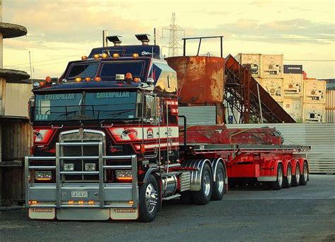 a large semi truck parked in front of a building