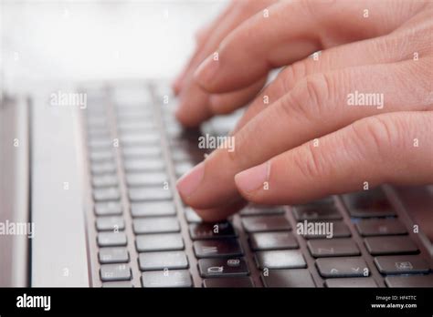 Hands typing on laptop computer Stock Photo - Alamy