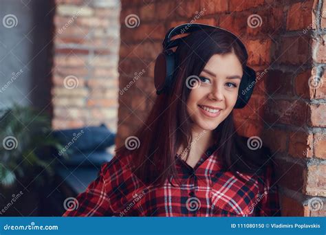 Portrait Of A Charming Brunette In A Flannel Shirt And Jeans Lis Stock Photo Image Of