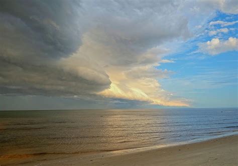 Storm clouds at beach Photograph by Michael Rodock - Pixels