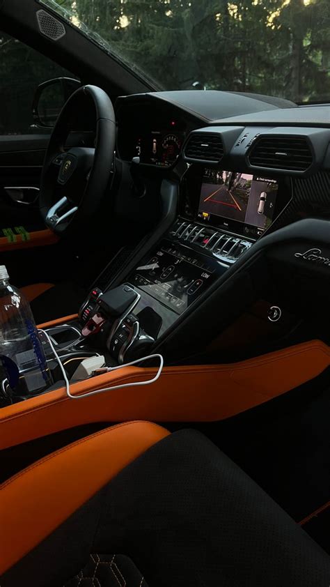 Lamborghini Urus Interior with Orange Trim and Black Leather Seats