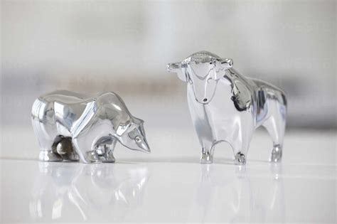 Bull And Bear Figurines On A Desk Stock Photo