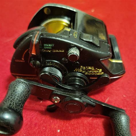 SHIMANO BANTAM MAGNUMLITE 2000SG BAITCASTING GRAPHITE TITANIUM IN GOOD