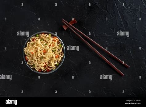 Instant Noodles Bowl With Carrot And Scallions Shot From The Top On A