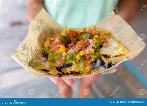 Close Up Of Hands Holding Mexican Nachos Stock Image Image Of