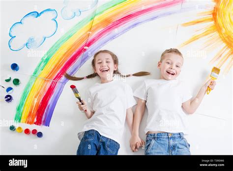 kids painting rainbow Stock Photo - Alamy