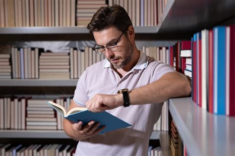 Premium Photo | Middle aged teacher or professor in school library ...