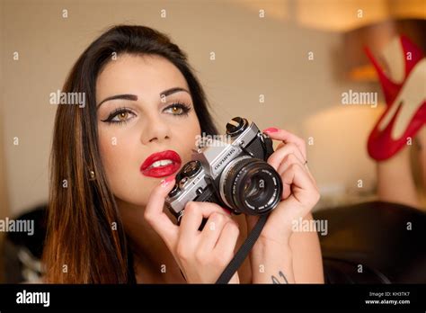 Beautiful Brunette Girl With A Film Camera Stock Photo Alamy
