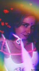 Redhead Chick Syd Sativa Shows Her Big Round Tits While Posing Photos