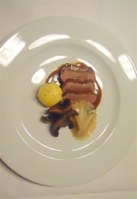 Seared Duck Breast With Fig Potato And Foie Gras Ravioli