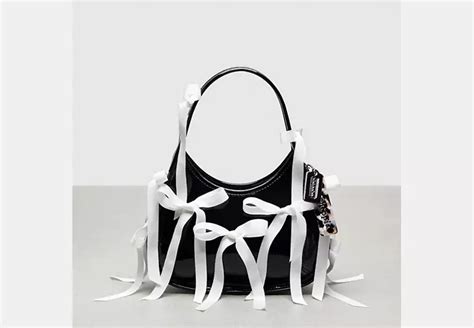 Ergo Bag In Crinkle Patent Coachtopia Leather With Allover Bows