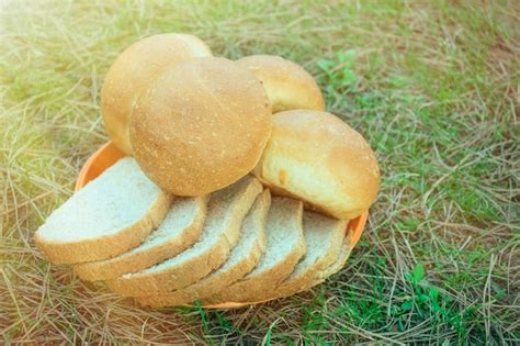 Premium Photo A Basket Of Bread Is Sitting On The Grass And Has Bread