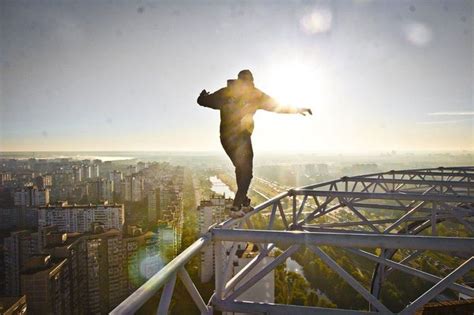 Dizzying Photos Of Ukrainian Daredevil Hanging From Tall Buildings