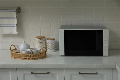 Premium Photo | Modern microwave oven on countertop in kitchen