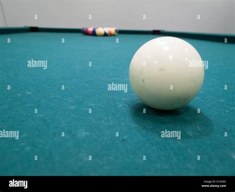 Cue ball with pool balls on the pool table Stock Photo - Alamy