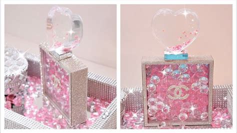 A Pink And Silver Box With A Heart Shaped Decoration On It S Lid Is Shown