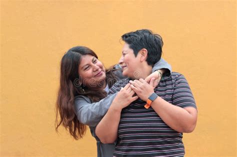 Married Latina Couple Cuddling Standing On The Beach Stock Photo Image Of Retired Elderly