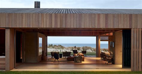 Fearon Hay S Te Arai House Frames Dunes Through Timber Shutters