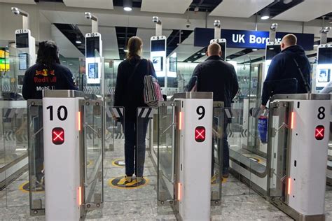 International Travelers Using An Egate Automated Passport Gate In An UK