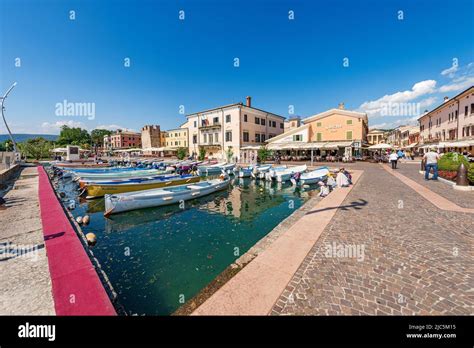 Small Port Of The Village Of Bardolino With Boats Moored Tourist