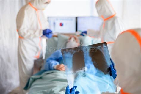 Medical Team Looking after Infected Patient in Hospital, Coronavirus Concept. Stock Photo ...