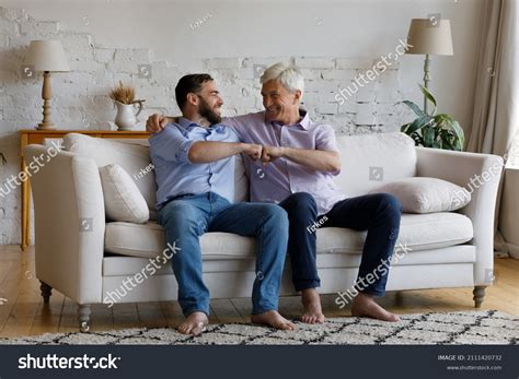 Happy Mature Grey Haired Dad Congratulating Stock Photo Edit Now