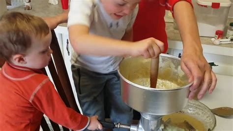 Children Making Homemade Applesauce With Crank Applesauce Maker Tomato