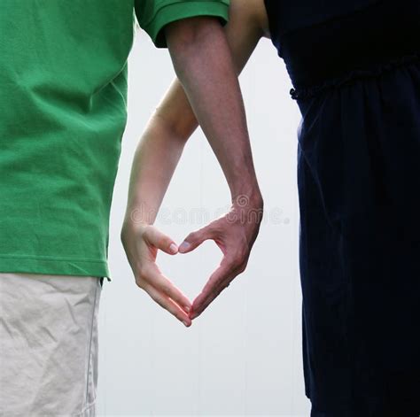 Couple Making A Heart With Their Hands Stock Photo - Image: 16651804