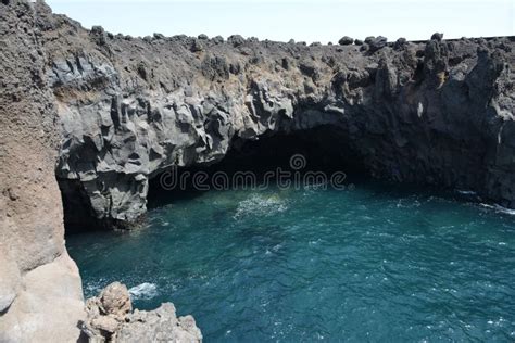 Beautiful Lagoon Under A Rocky Cliff With A Cave Stock Photo Image Of