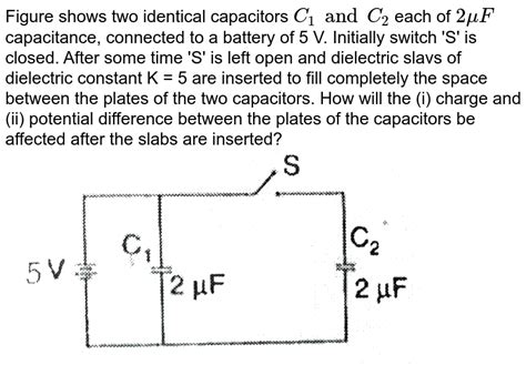 Figure Shows Two Identical Capacitors C1 And C2 Each Of 1μf Capaci