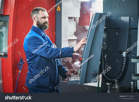 Industrial Worker Operating Cnc Machine Metal Stock Photo 1971109901