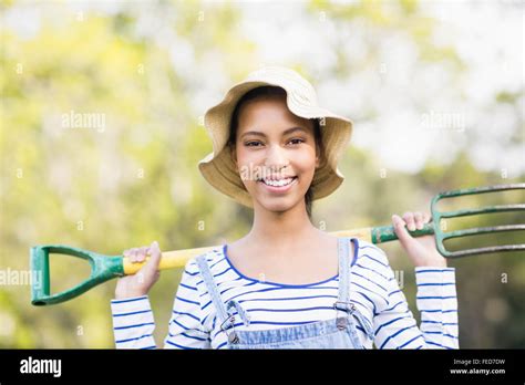 Pretty Brunette Doing Some Gardening Activities Stock Photo Alamy