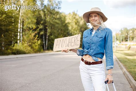 Young Wonderful Woman Raising Hand With Cardboard With Inscription