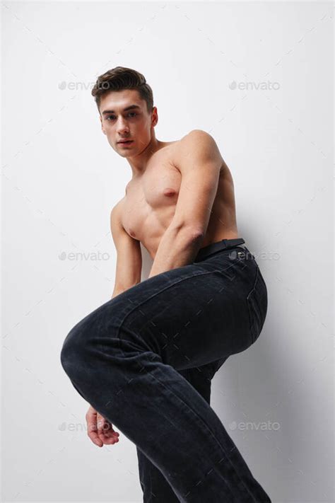 Bottom View Of A Sports Man With A Naked Torso And Trousers Stock Photo By Shotprime
