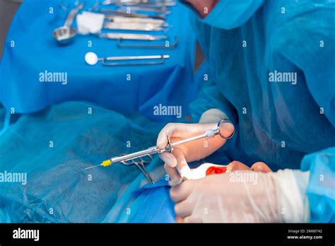 Dental clinic, dentist doctor applying anesthesia injection to patient Stock Photo - Alamy