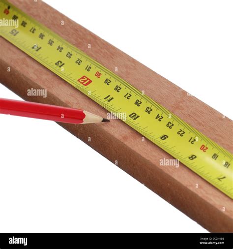 Pencil marking wood with steel measure on white background Stock Photo ...