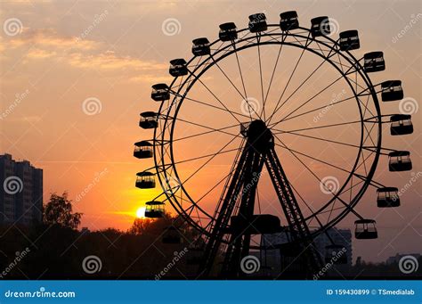 Ferris Wheel and Sunset stock image. Image of silhouette - 159430899