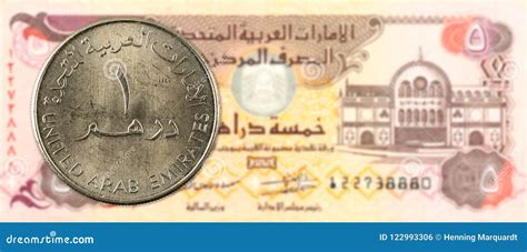 1 Dirham Coin Against 5 United Arab Emirates Dirham Bank Note Stock ...