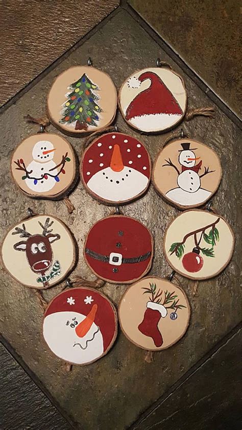 Twelve Decorated Wooden Christmas Ornaments On A Table