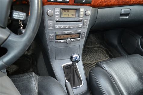 Центральная консоль [714a]. — Toyota Avensis II, 2,4 л, 2005 года ...