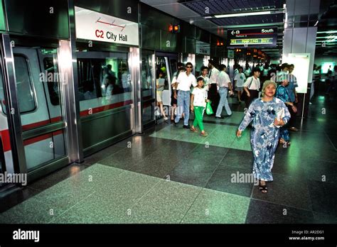 Singapore transport City Hall Station passengers leaving train Mass Rapid Transit system Stock ...