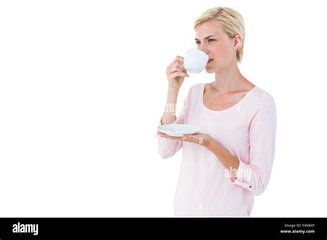 Attractive Blonde Woman Drinking Hot Beverage Stock Photo Alamy