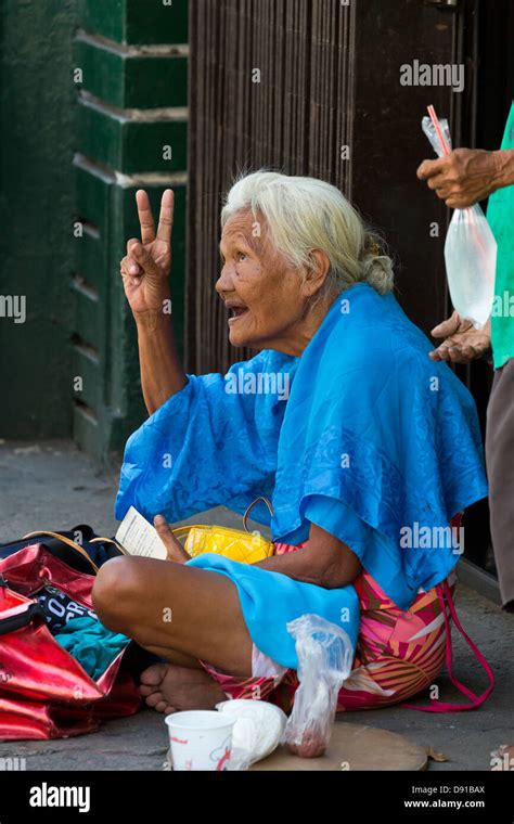 Old Woman in the Street in Manila, Philippines Stock Photo - Alamy