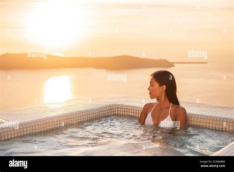 Luxury Resort Woman Swimming In Jacuzzi Hot Tub Outside On Private