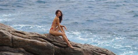 Epic Scene Aerial Drone View Of Bikini Woman Model On A Rock At The Sea Stock Photo Image Of