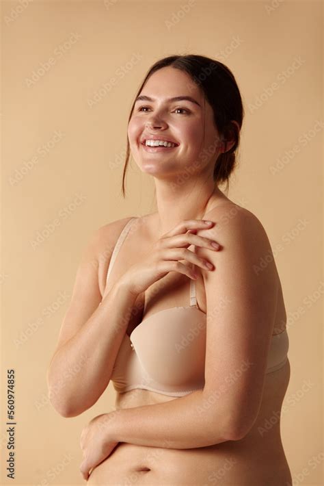 Plus Size Woman Happy Woman Posing In Beige Lingerie At Studio Confident Plus Size Lady