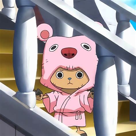 a cartoon bear in a pink outfit standing on some stairs with his hands ...